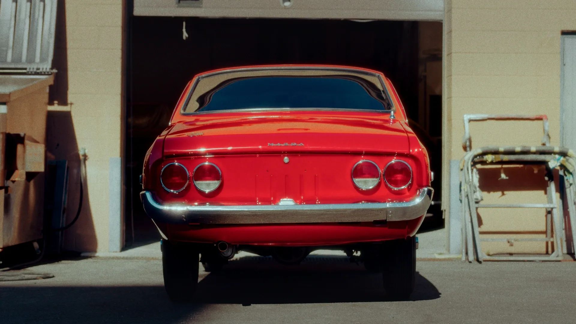 A classic coupe in the bay at Stamford Autobody