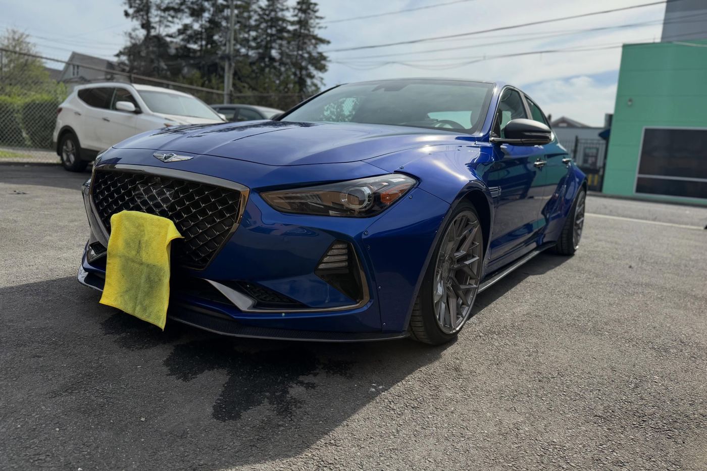 A Genesis G70 finished and detailed at the shop