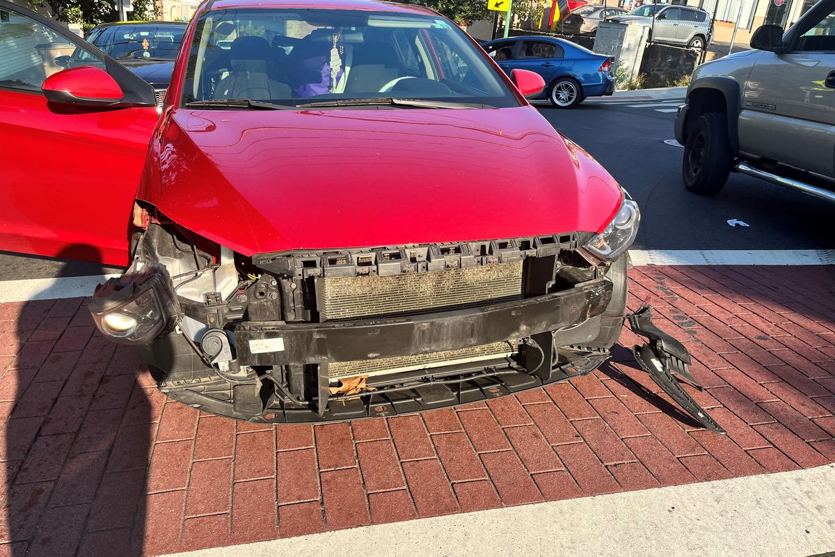 A car with the front end destroyed in a collision, at the shop for repair