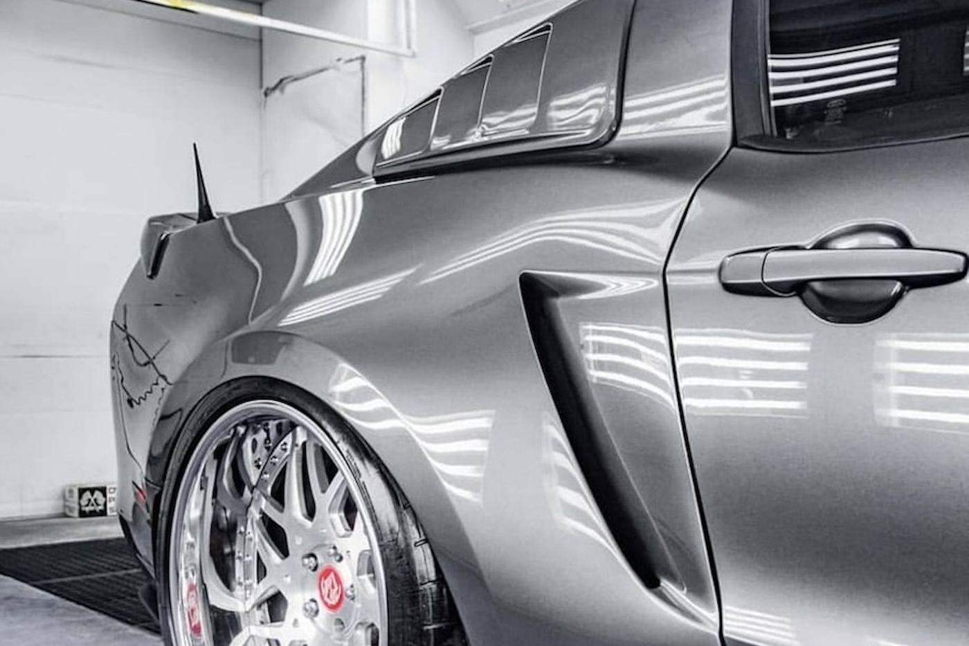 A widebody build in the shop, rear quarter panel finished